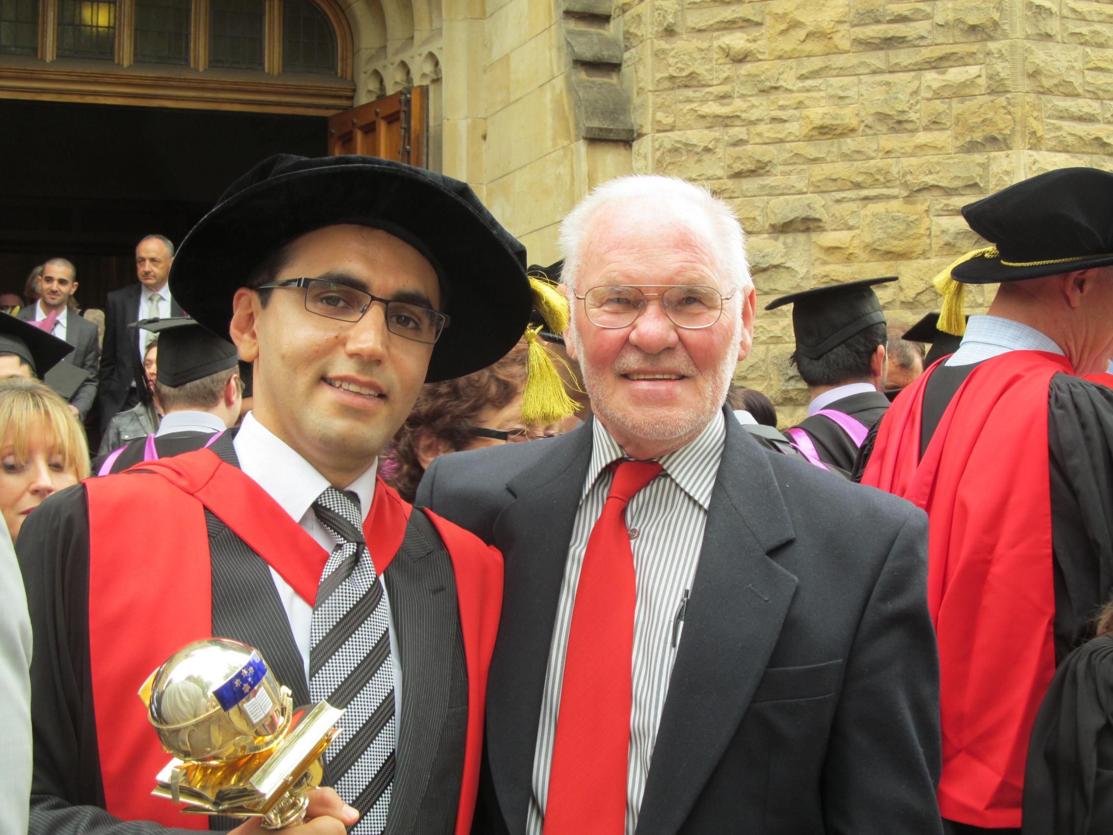 Talking with Aussies Volunteer Ron Seidel with graduating student Omid 