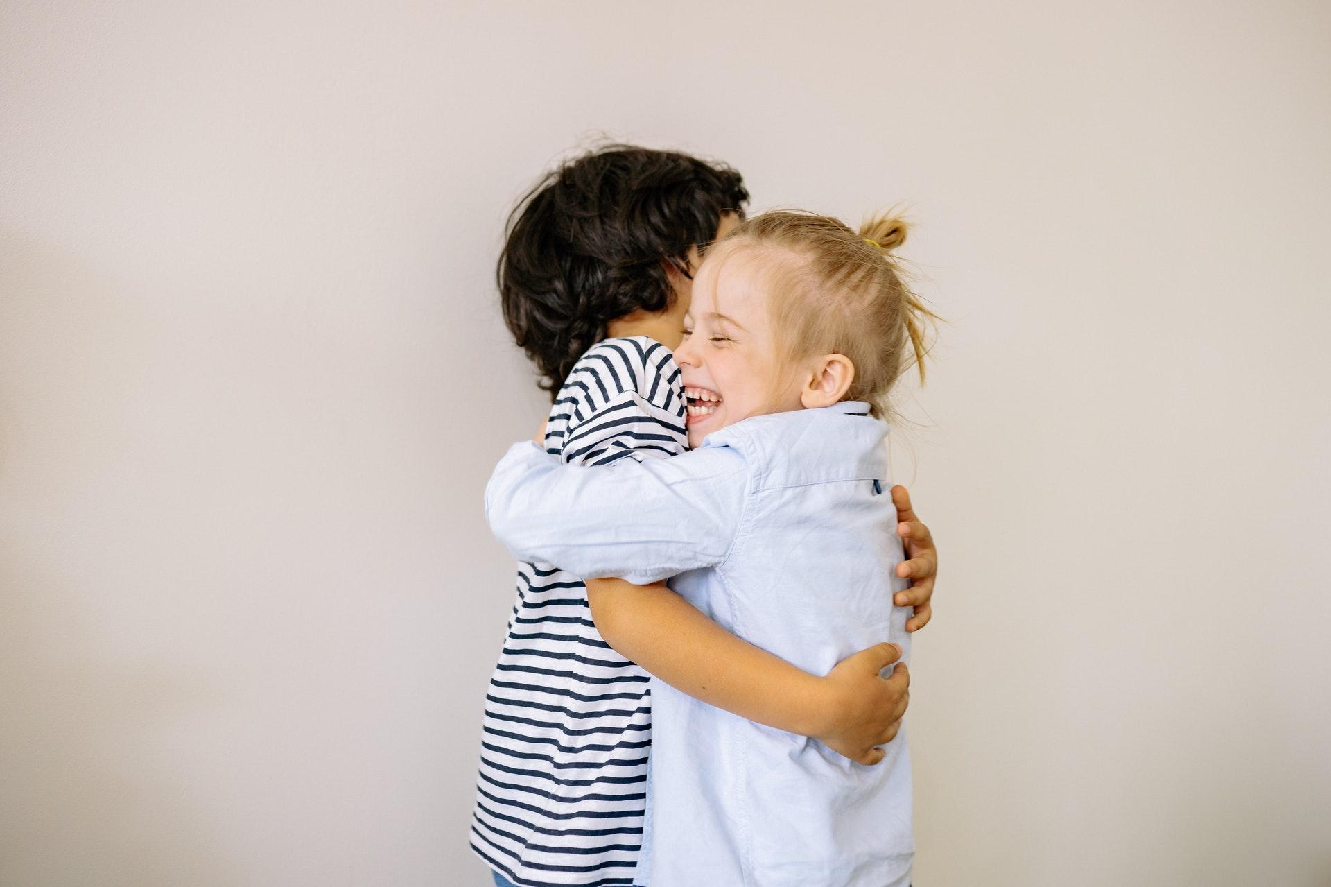 Toddlers hugging