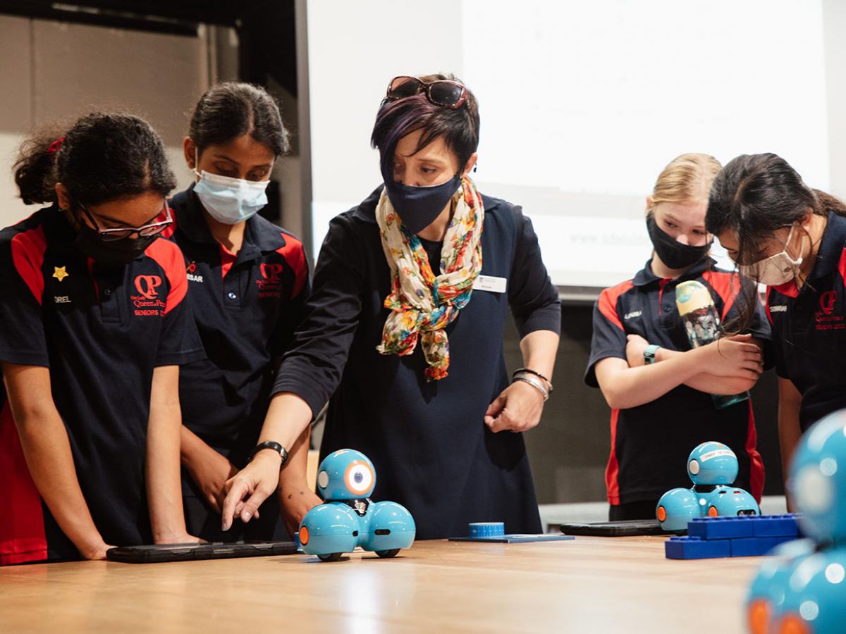 Michelle McLeod (STEM Teacher in Residence) programs rovers with students from Our Lady Queen of Peace School.