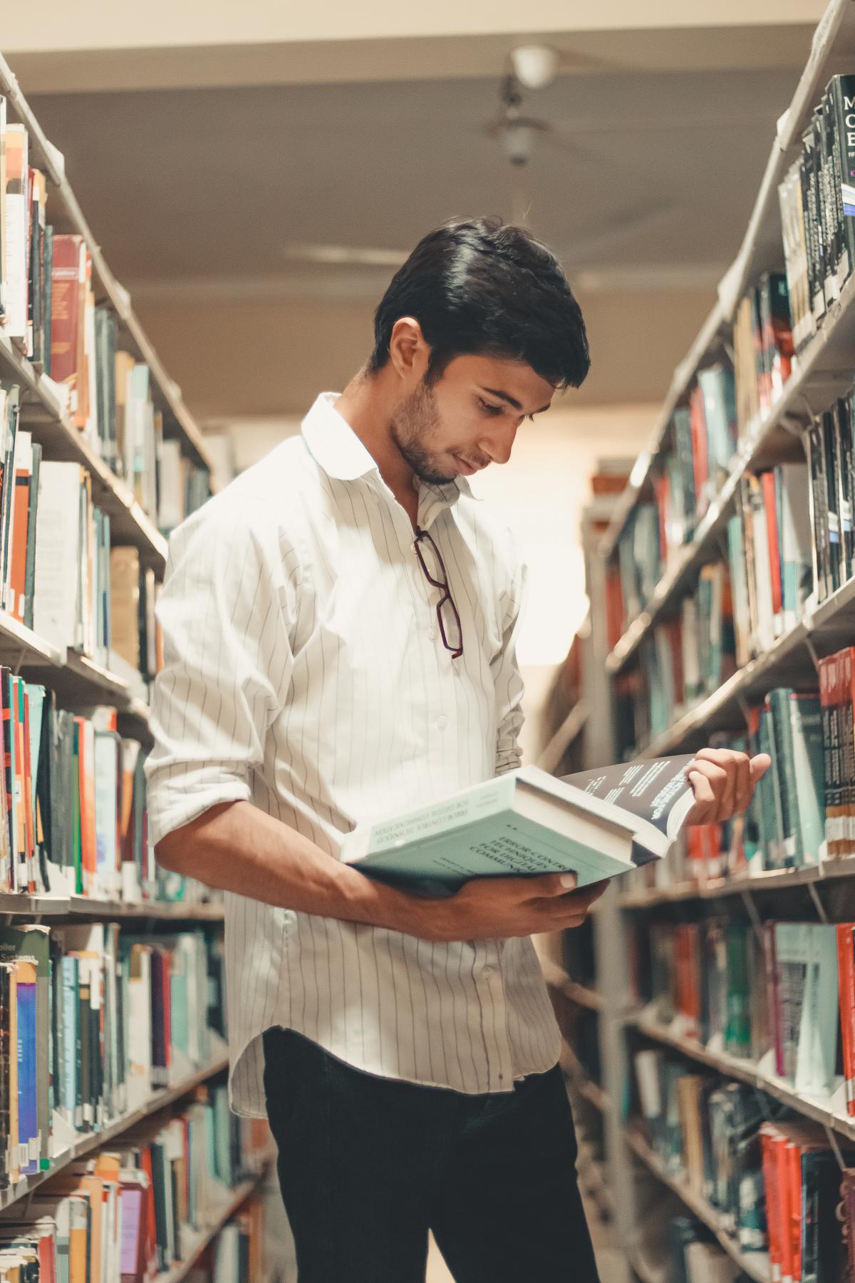 Man reading in library