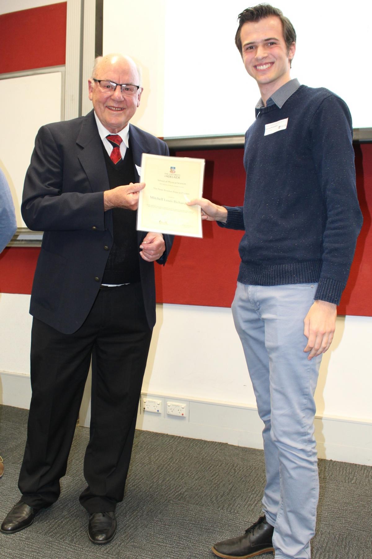 Dr Peter Brooker awarding Mitchell Richardson with Prize