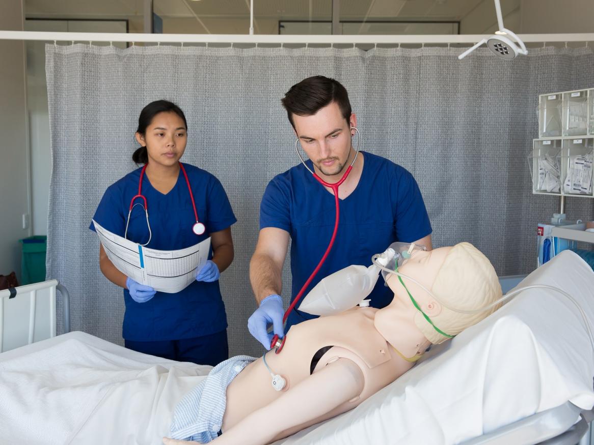 AHMS students with a dummy patient