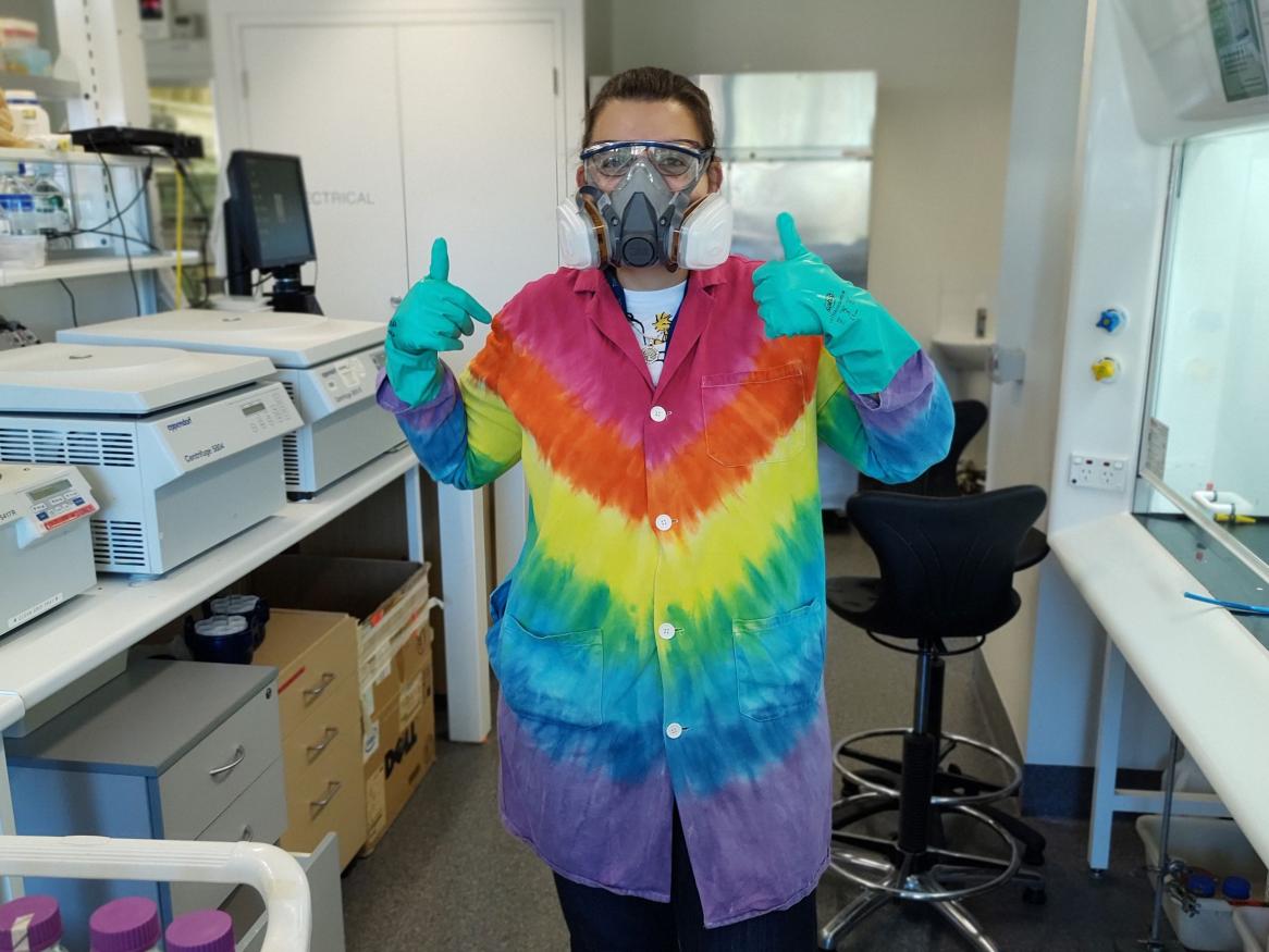 Female scientist in rainbow laboratory coat