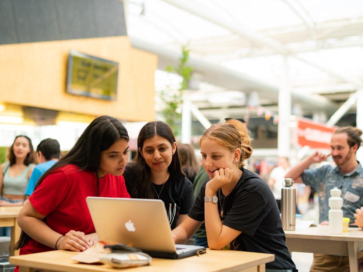 Students looking at a laptop