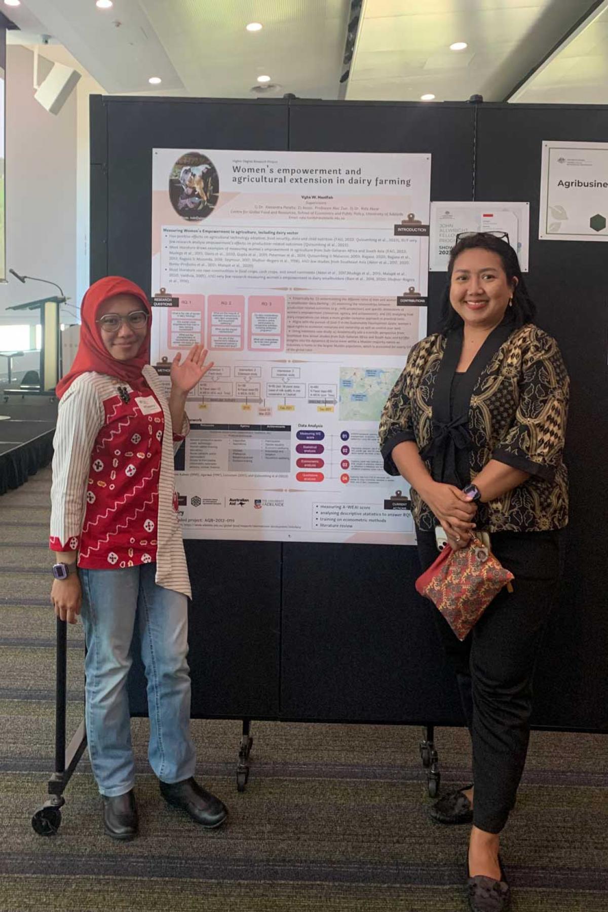 Vyta (left) with her research poster and Wina (right), the assistant country manager for ACIAR Indonesia