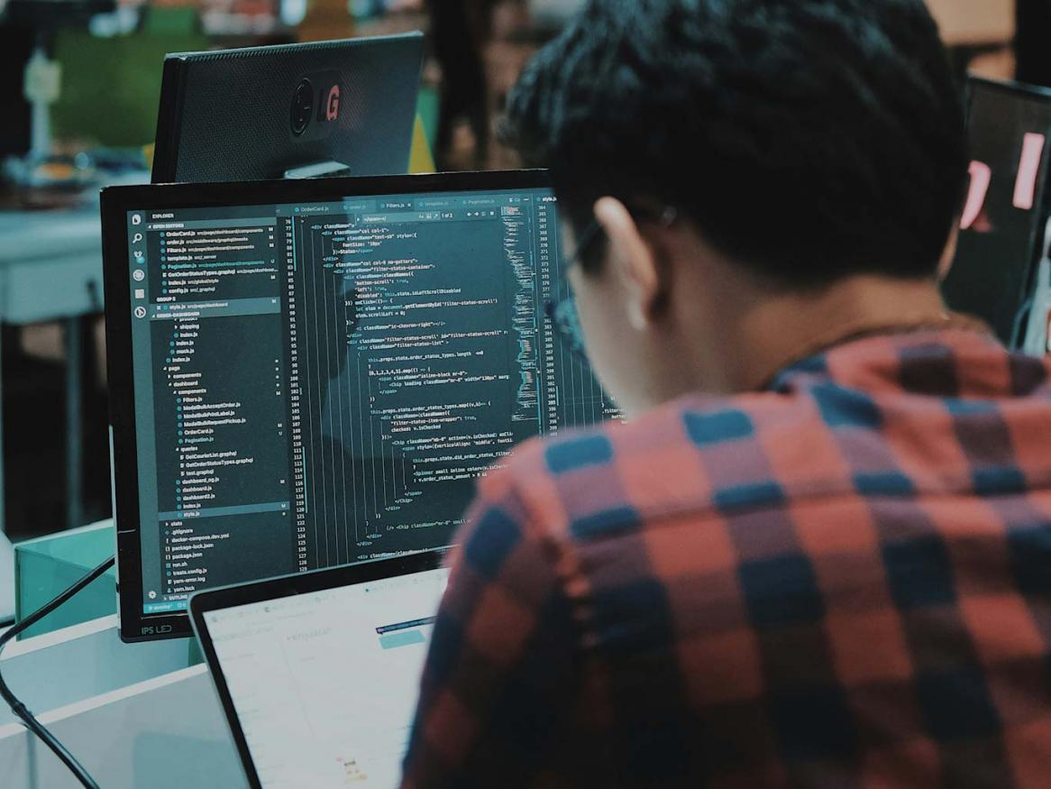 A person reviewing computer code.