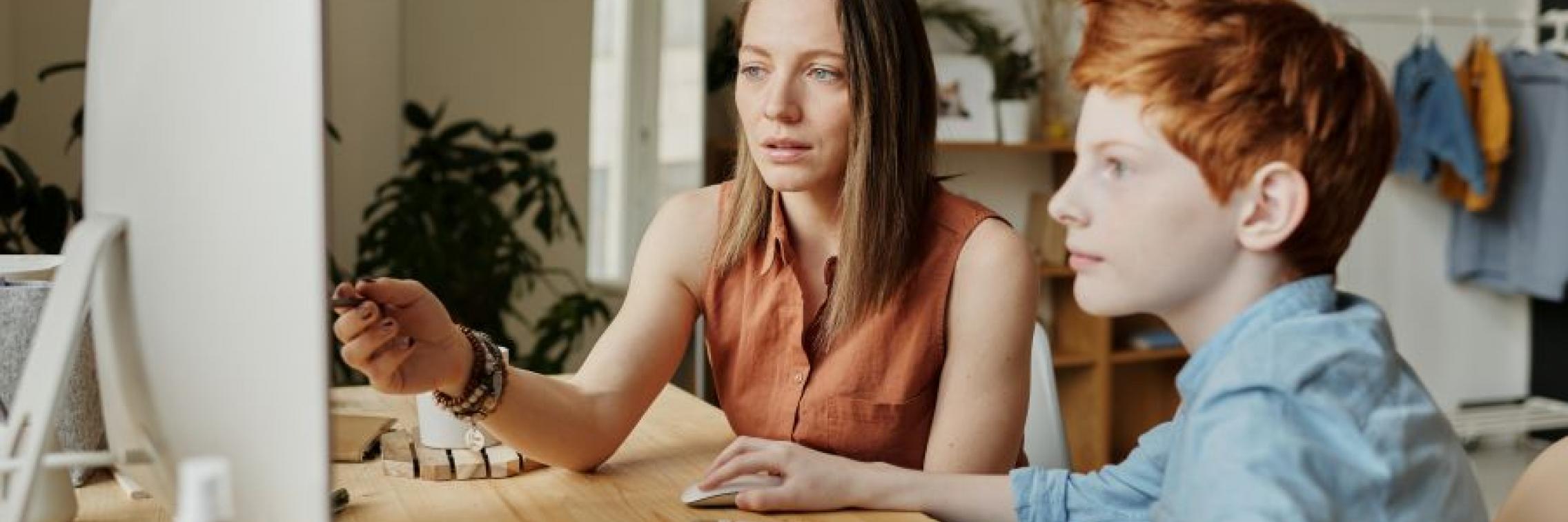 Woman tutoring child