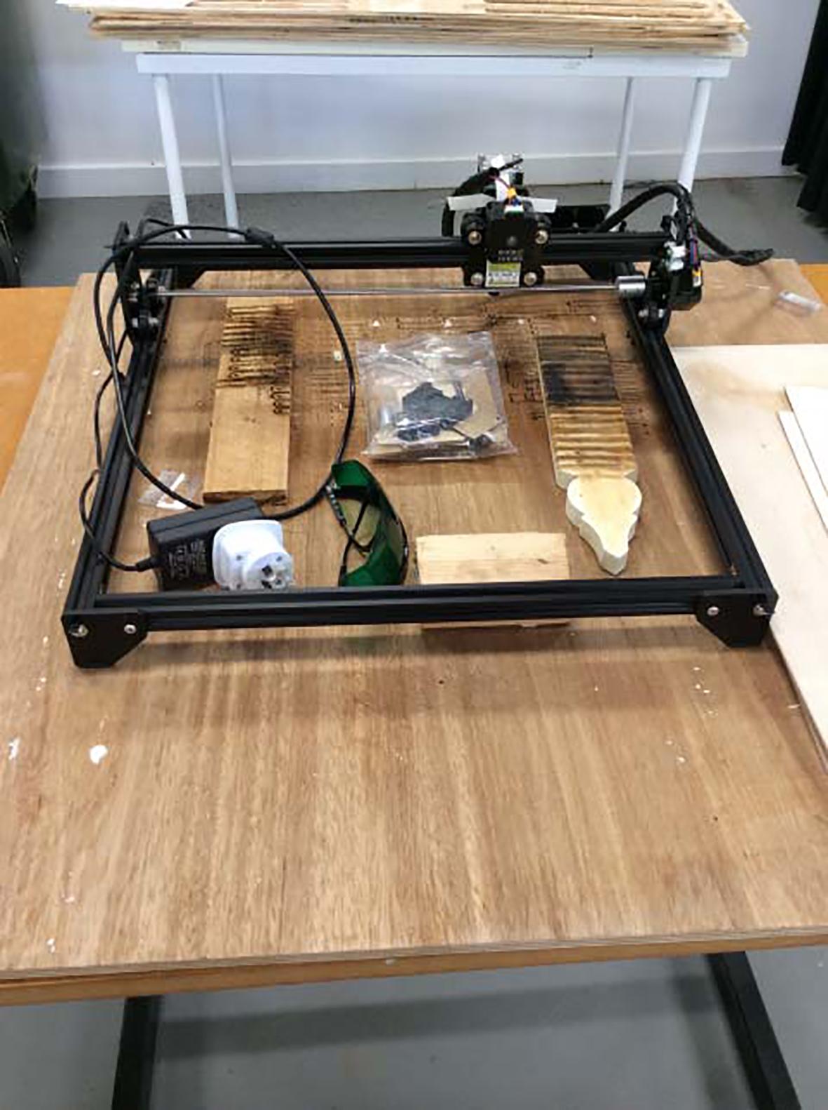 Unenclosed laser cutter