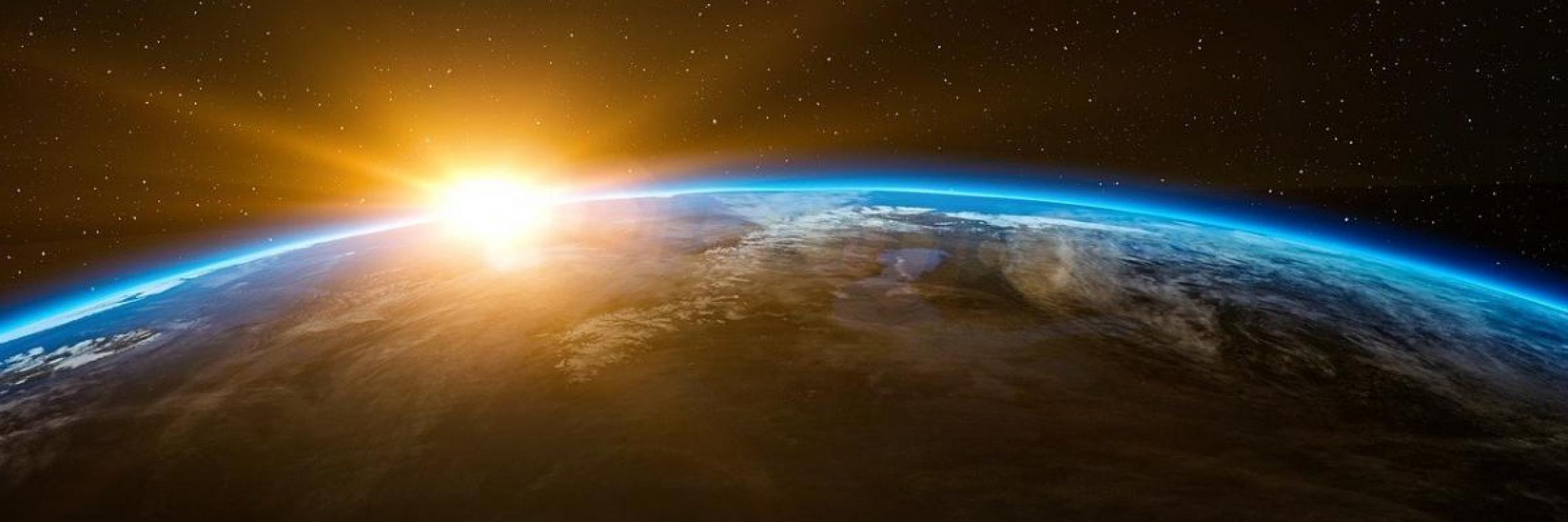 sun rising over earth
