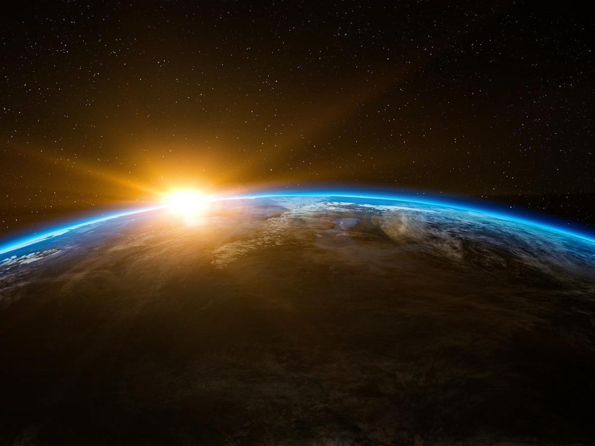 sun rising over earth