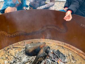 Uncle Fred Agius and students around the Kaurna Learning Circle fire pit