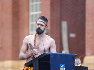 Jack Buckskin leads a performance as part of the opening of the Kaurna Learning Circle