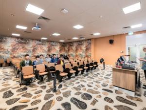 Photo of seminar room with funky flooring and orange seating in Barr Smith South