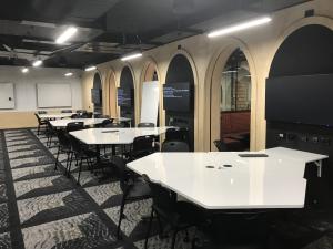 Photograph of room 2032 showing tables, chairs and interior archways