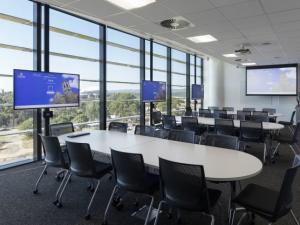 Photo of a meeting room with beautiful windows and natural light.