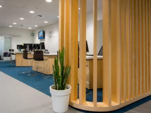 Photo of front desk area showcasing wooden open wall feature