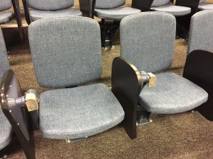 Close up of grey seating with fold up desks in a Napier lecture theatre