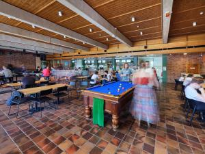 Students playing pool in the UniBar