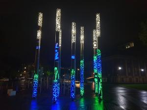 Kaurna poles glowing at night
