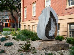 Indigenous sculpture Spriggina Floundersi with landscape