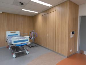 Physiotherapy treatment room with wood panelling