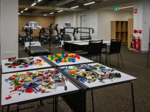 Lego spread out on tables for physiotherapy rehabilitation