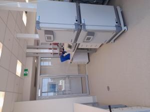 SAiGENCI building refurbishment progress. Picture of a corridor with lab equipment.