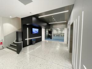 Integrative Bioimaging Facility foyer with TV and lights.jpg