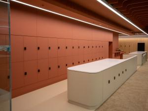 HDR Student Hub - long white bench and locker storage