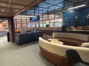 Fitness Hub main entrance with front desk and merchandise display cabinets