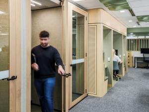 Student exiting booth in HDR Hub