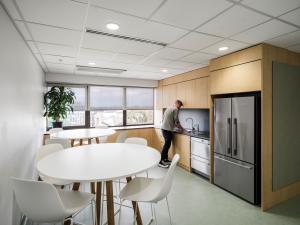 HDR Hub kitchenette with person at the sink