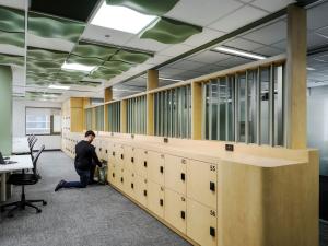 HDR Hub showing a person kneeling near a row of lockers