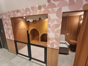 Parents Room with feeding cubicle and toddler play pen