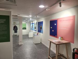 Ira Raymond Exhibition Room with gallery lighting and artwork