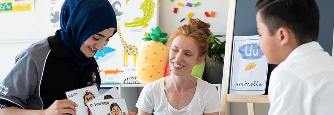 Photo of student speech pathologist working with clients