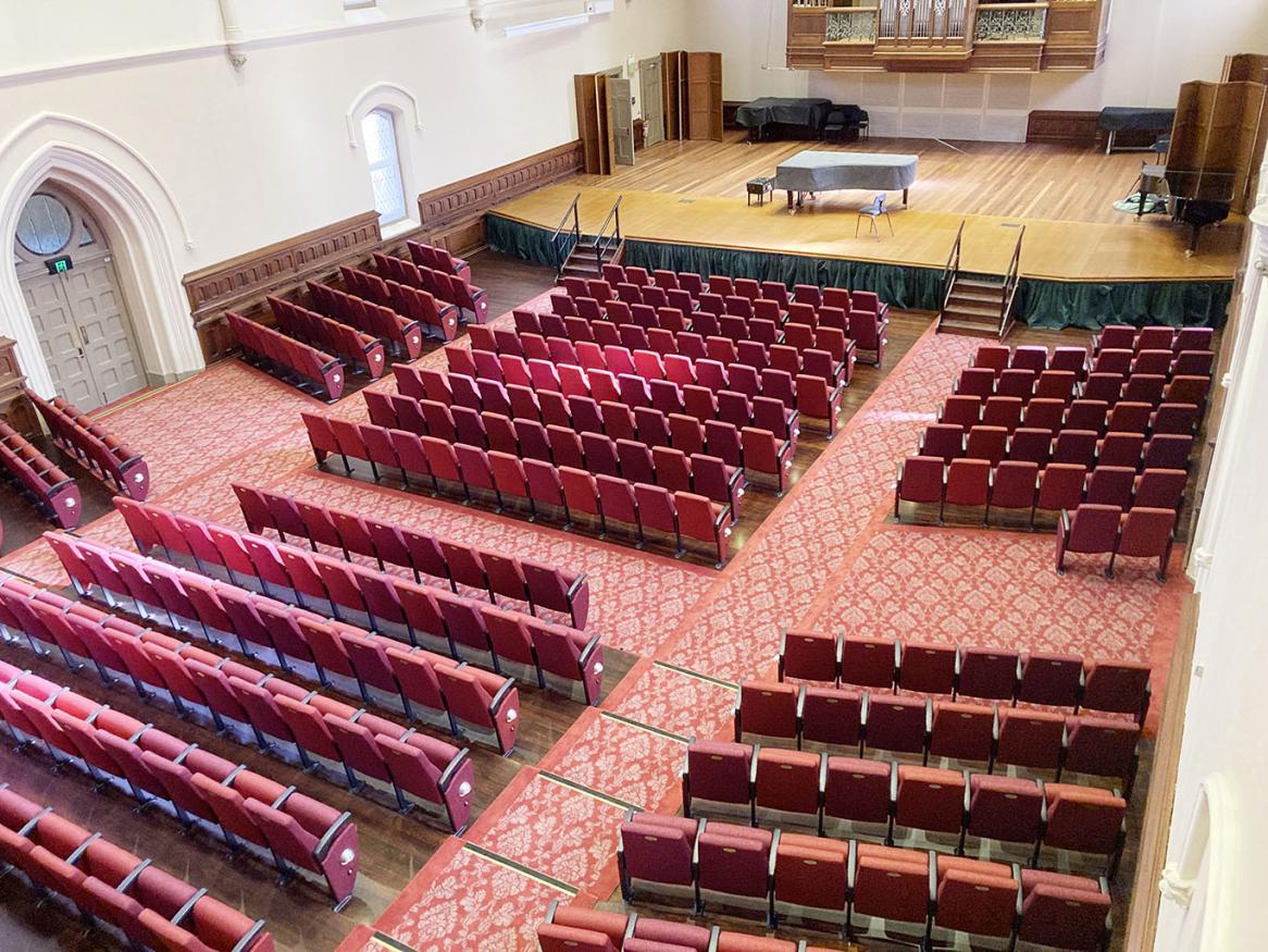 Elder Hall interior showing new seats looking down from the balcony seating toward the stage