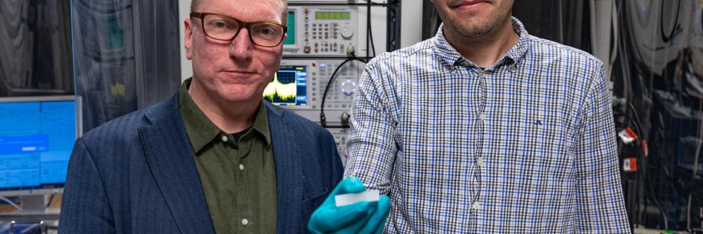 Arnan Mitchell and Andy Boes with a photonic chip