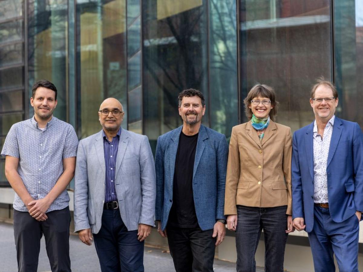 Photo of the five Adelaide COMB Chief Investigators standing in front of the Braggs building at the University of Adelaide