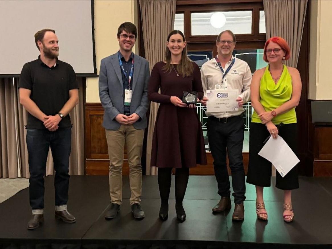 L to R) Dr Moritz Merklein (representing ANZOS), Dr Chris Perrella, Dr Sarah Scholten, Prof Andre Luiten, Prof Frederique Vanholsbeeck (representing ANZOS)