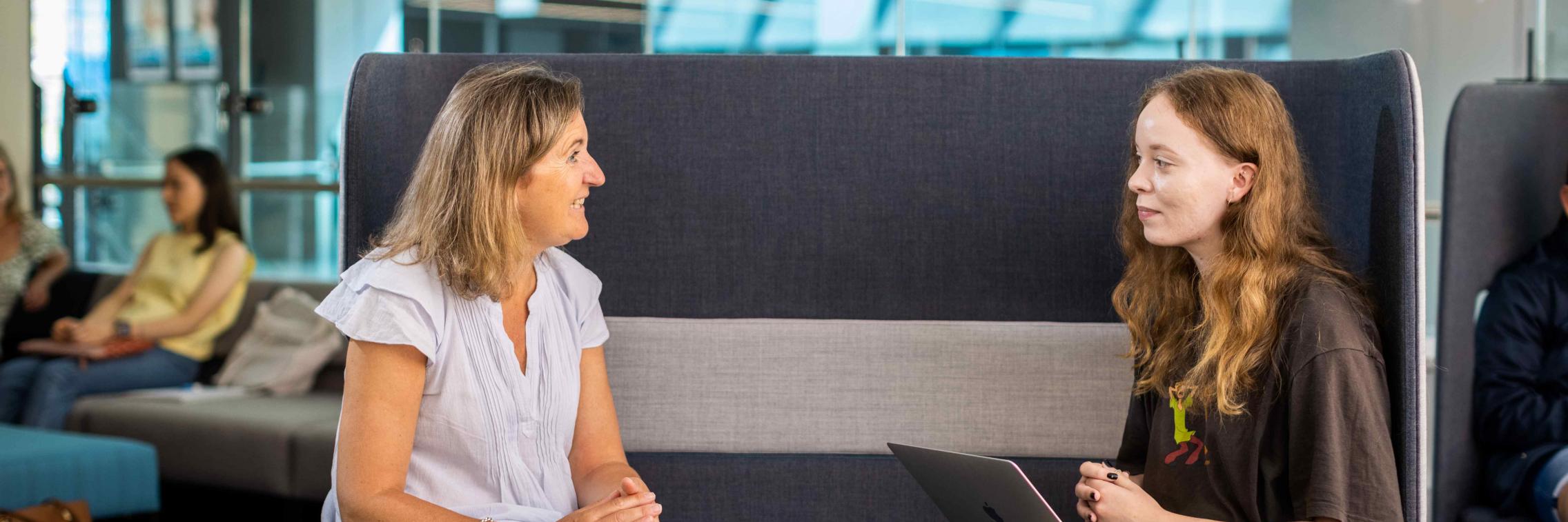 Women talking at a casual meeting