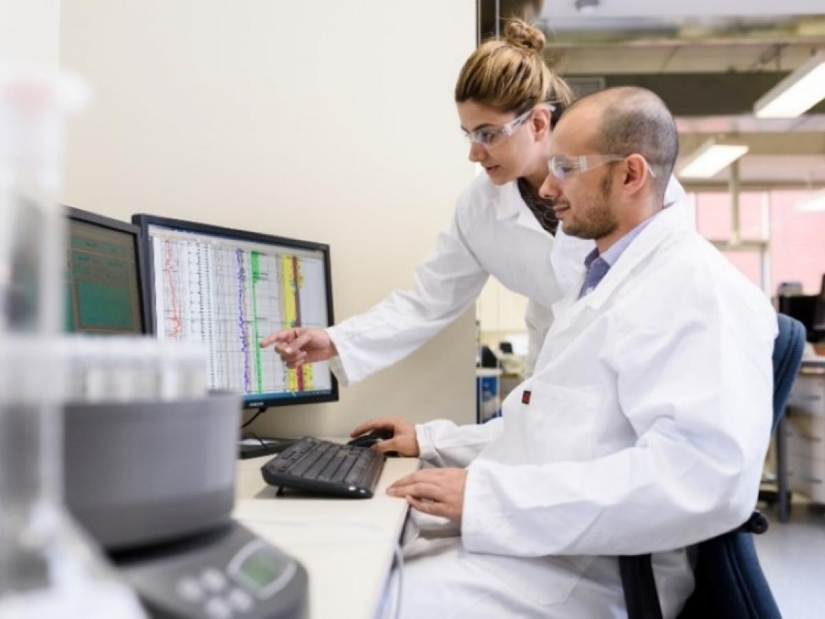 Scientists checking data at a lab