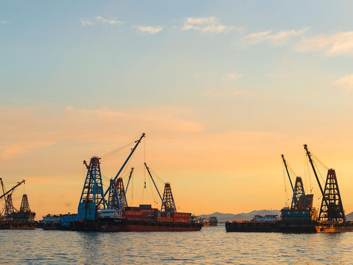 Cargo boats at sunset