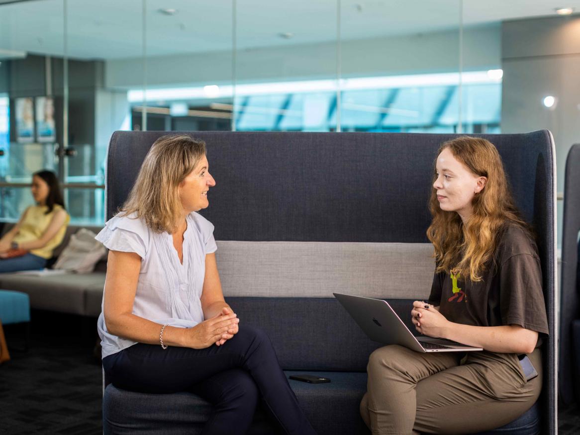 Women talking at a casual meeting