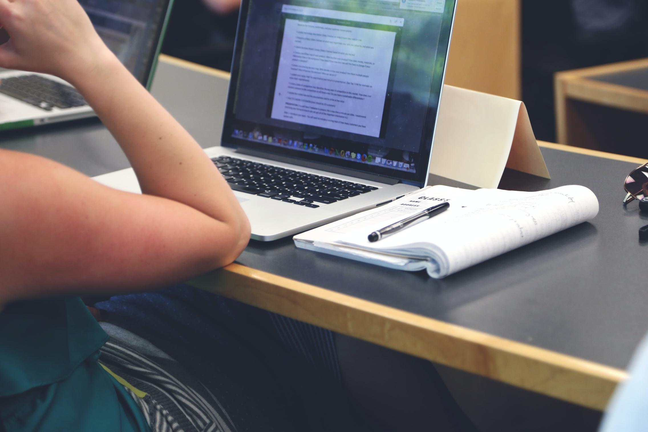 A student in front of a laptop