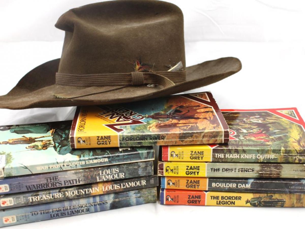 Choate hat on a stack of books