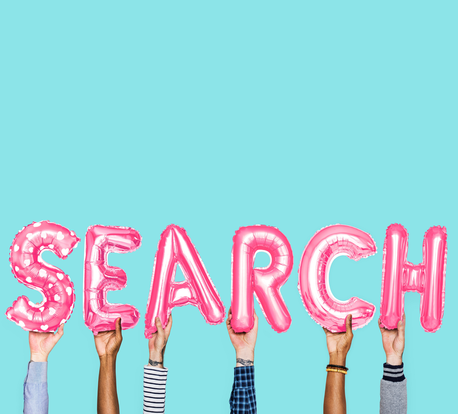 hands holding up search balloons