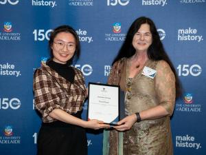 Jiaxuan Chang accepting her award with Jennie Shaw