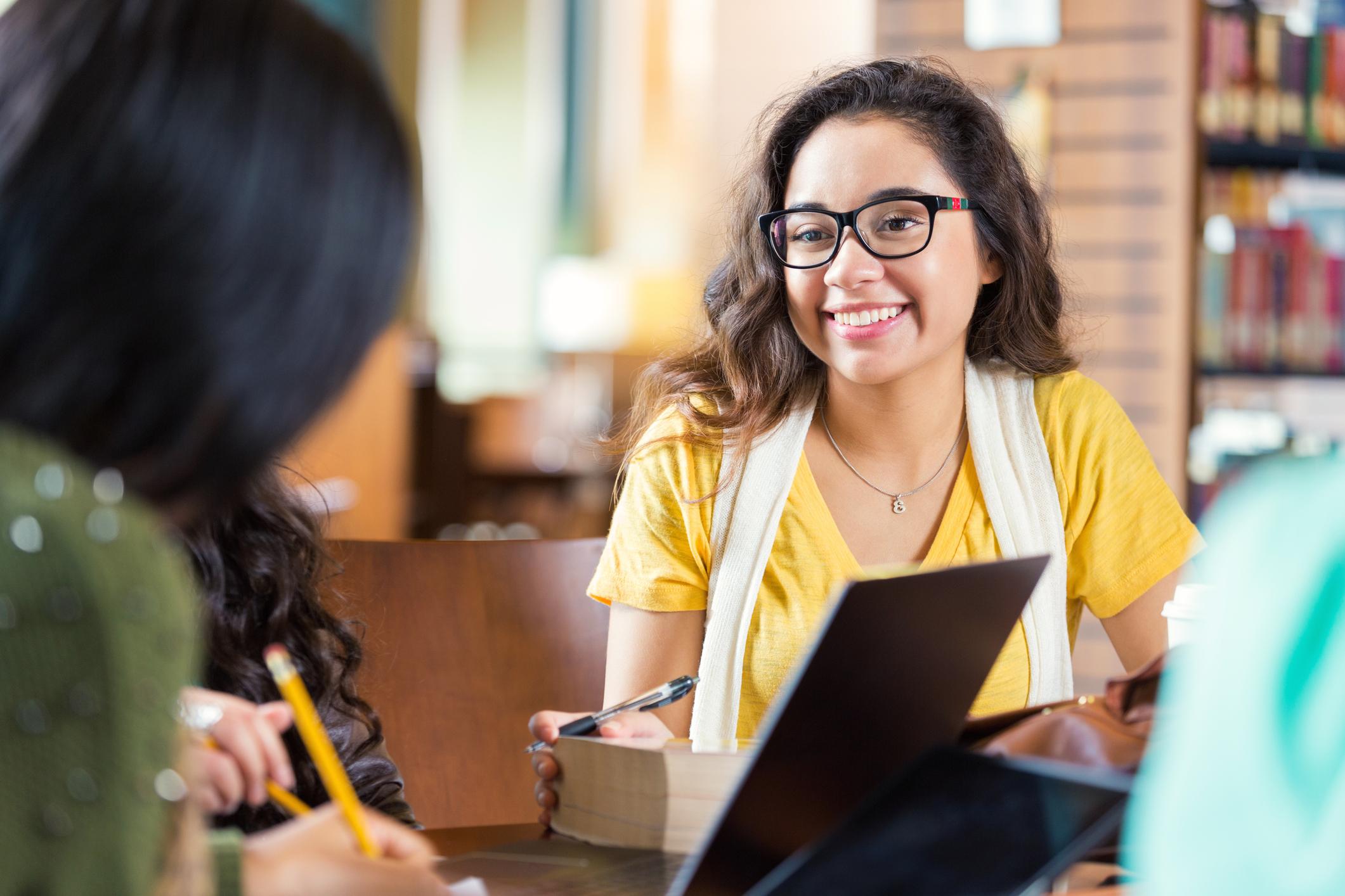Student talking with Ask Library staff member