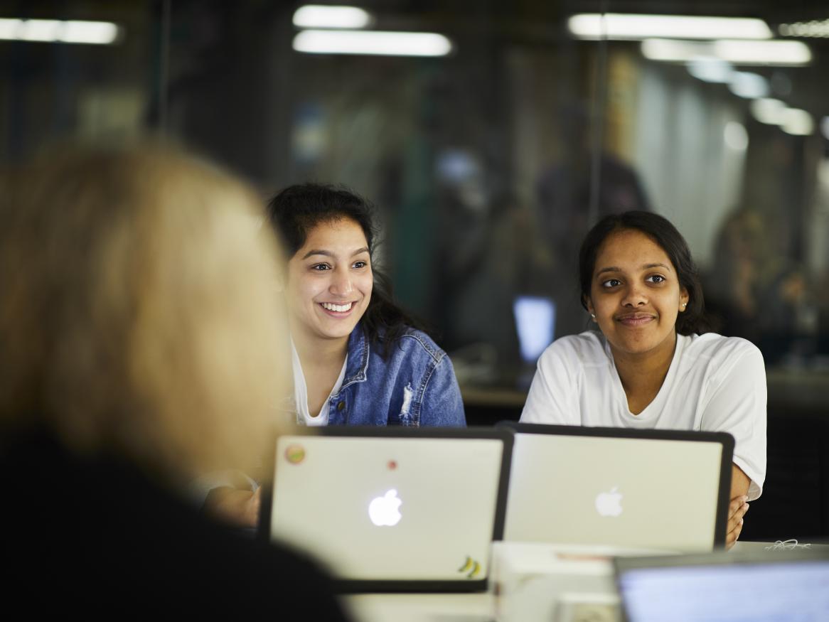 Students behind computer screens